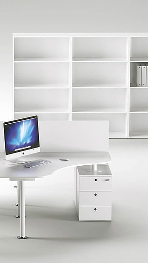 Minimalist White Office Workspace with Curved Desk and Built-in Shelving HD phone wallpaper