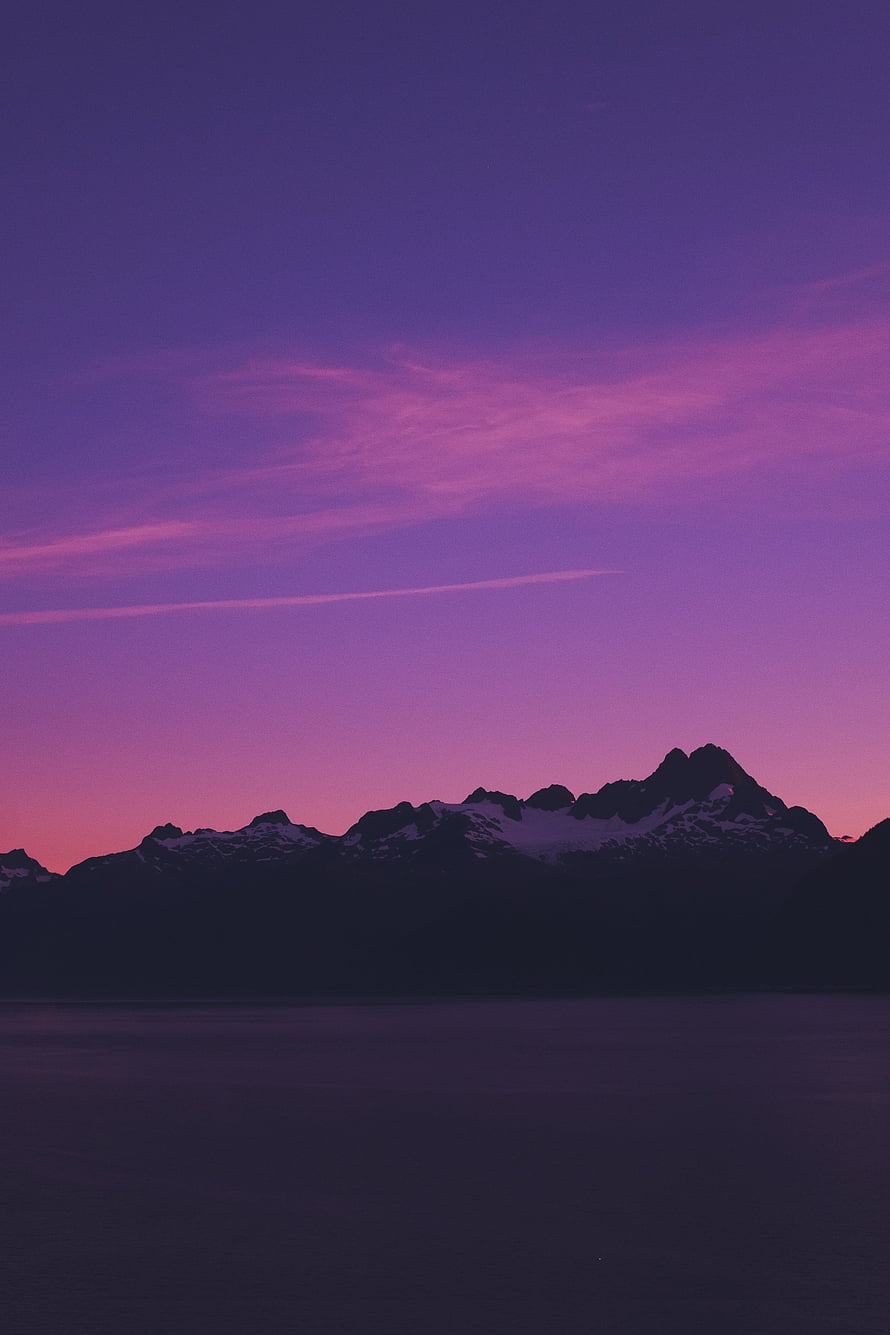 Purple Twilight Over Snow-Capped Mountain Ranges and Calm Water Surface HD phone wallpaper