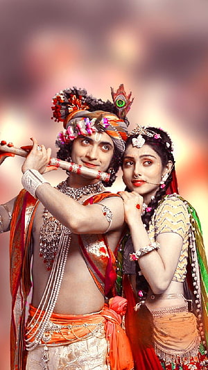 Radha Krishna in Traditional Indian Attire with Flute and Floral Headdress HD phone wallpaper