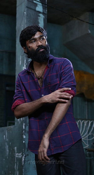 Dhanush in Vada Chennai wearing a purple plaid shirt with a serious expression HD phone wallpaper