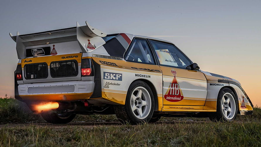 Audi Sport Quattro S1 Rally Car with Exhaust Flames at Sunset HD wallpaper