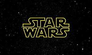 Star Wars Classic Yellow Logo on Deep Space Starfield Background HD wallpaper