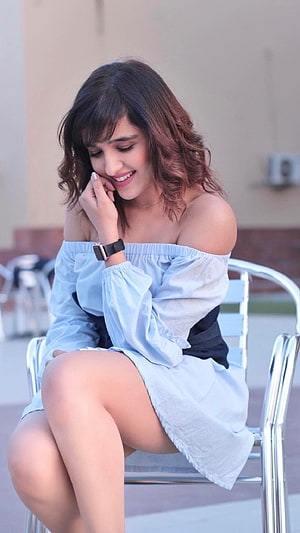 Shirley Setia in a Light Blue Off-Shoulder Dress Sitting on a Metal Chair HD phone wallpaper