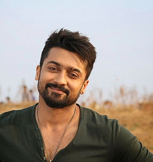 Portrait of a smiling man with a beard wearing a dark green henley shirt outdoors HD phone wallpaper
