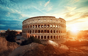 Colosseum in Rome at Golden Hour with Dramatic Sky and Ancient Roman Architecture HD wallpaper