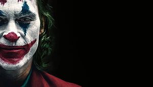 Joker Character Close-Up Portrait With Clown Makeup And Dark Background HD wallpaper