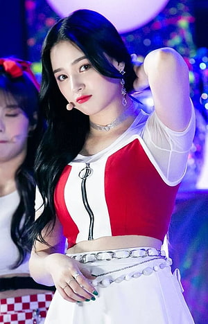 Nancy from Momoland in a red and white stage outfit with chain belt and long black hair HD phone wallpaper