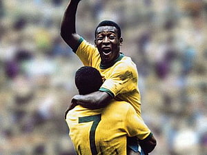 Pele Celebrating a Goal in Classic Brazil National Team Yellow Jersey HD wallpaper