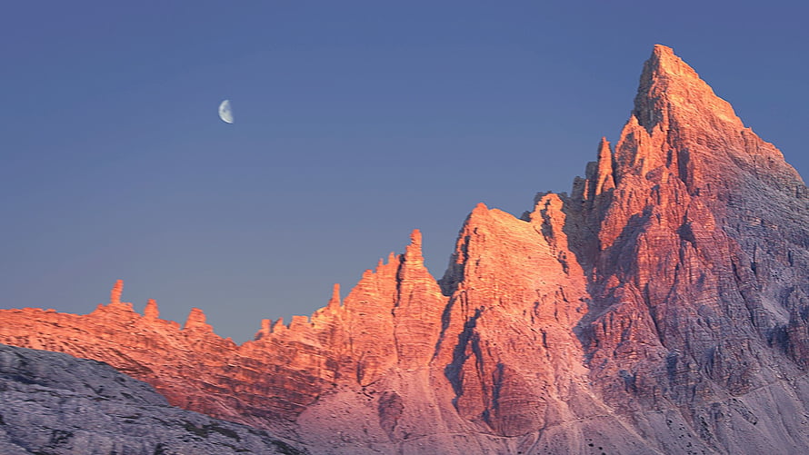 Alpine Mountain Peaks Bathed in Golden Sunset Light with Crescent Moon HD wallpaper