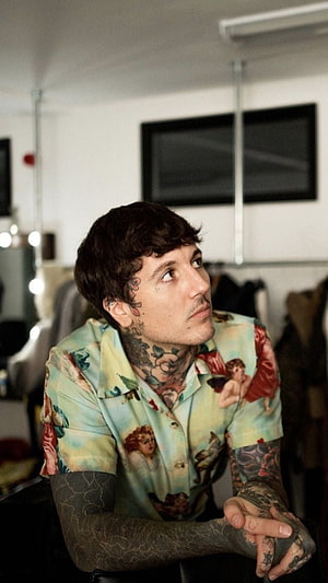 Oli Sykes of Bring Me The Horizon in a vintage cherub print shirt with full sleeve tattoos HD phone wallpaper
