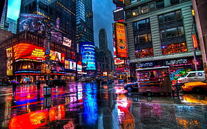 Times Square New York City Rainy Night with Neon Lights and Wet Street Reflections HD wallpaper