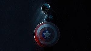 Captain America in Dramatic Dark Lighting with Iconic Shield HD wallpaper