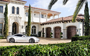 Silver Ferrari 599 GTB parked in front of a grand Mediterranean style luxury mansion estate HD wallpaper