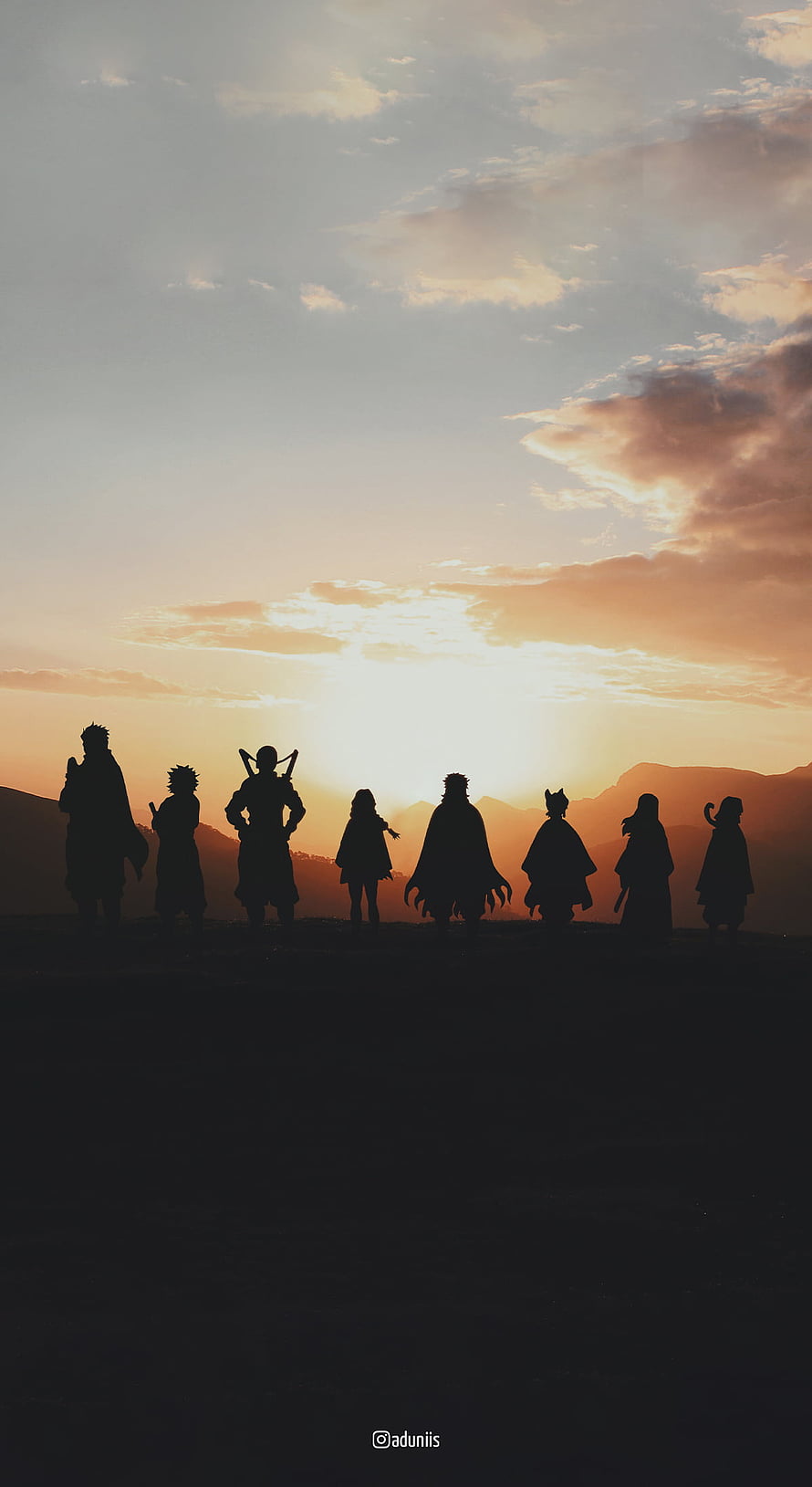 Demon Slayer Corps Silhouettes Against a Golden Sunset Sky HD phone wallpaper