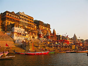 Varanasi Ghats and Temple Complex Along the Ganges River at Golden Hour HD wallpaper