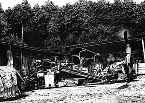 Goodnight Punpun Anime Scene of Cluttered Outdoor Workshop with Tall Figure HD wallpaper
