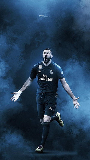 Karim Benzema in Real Madrid Black Kit Celebrating with Dramatic Blue Smoke Background HD phone wallpaper