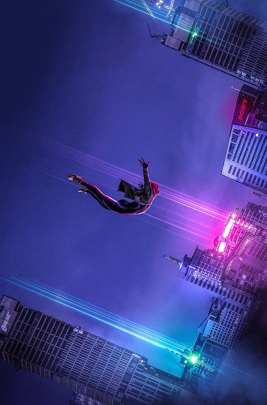 Miles Morales leaping through a neon-lit cityscape in Spider-Man Into the Spider-Verse style HD phone wallpaper