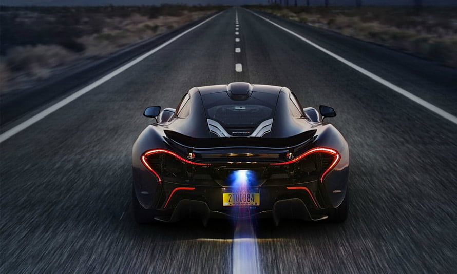 McLaren P1 Rear View on Desert Highway at Dusk with Blue Exhaust Flame HD wallpaper