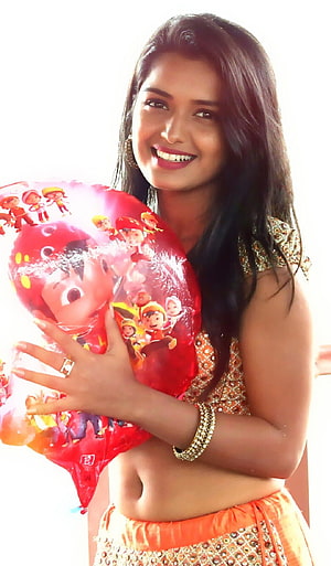 Priyanka Jain in Orange Ethnic Wear Holding a Red Cartoon Balloon HD phone wallpaper