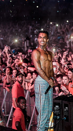 XXXTentacion performing shirtless on stage at a live concert with a large crowd HD phone wallpaper