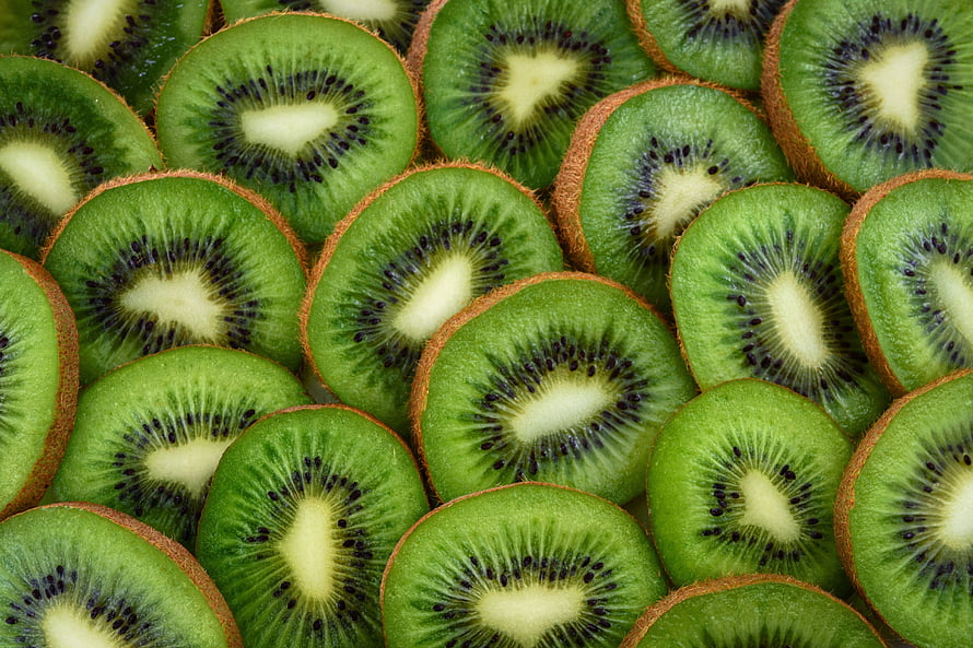 Fresh Sliced Kiwifruit Pattern With Vibrant Green Flesh And Black Seeds HD wallpaper
