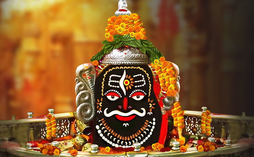 Mahakaleshwar Jyotirlinga adorned with marigold garlands and silver ornaments in Ujjain temple HD wallpaper