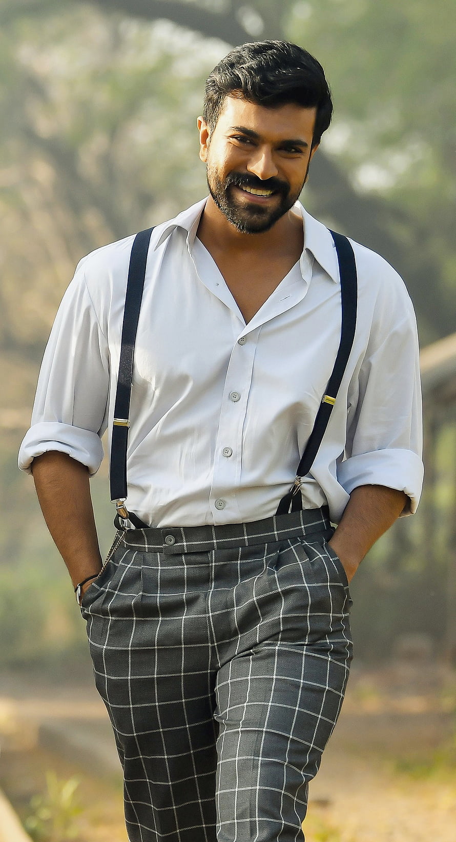 Ram Charan in white shirt and checkered trousers with suspenders HD phone wallpaper