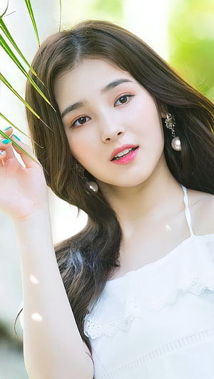 Nancy from Momoland in a white lace top with pearl earrings and green foliage HD phone wallpaper