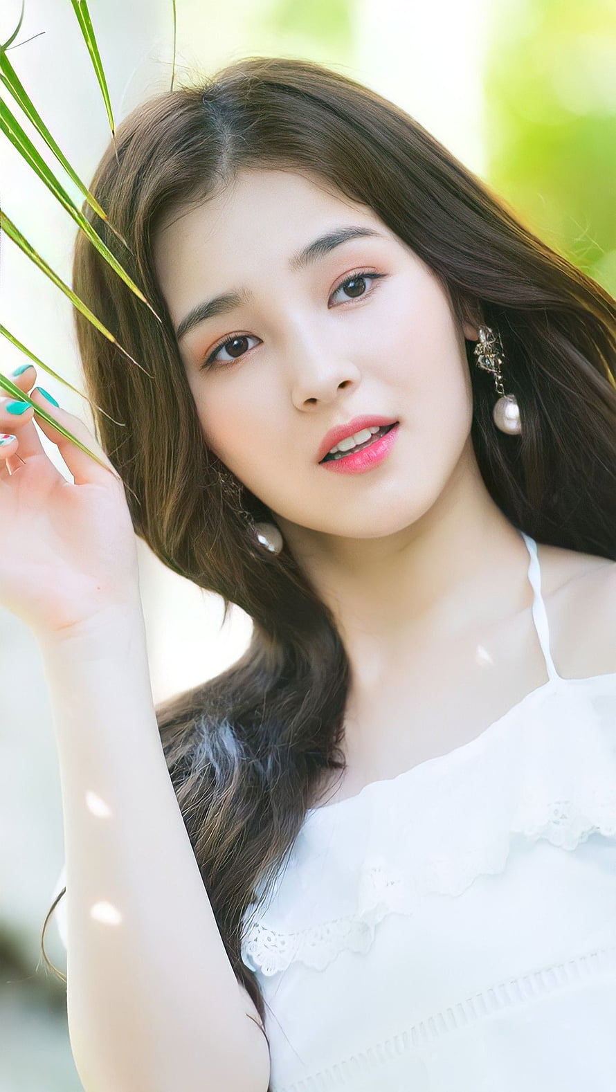 Nancy from Momoland in a white lace top with pearl earrings and green foliage HD phone wallpaper