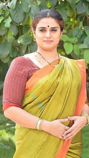 Pavitra Lokesh in a Green and Orange Silk Saree with Gold Jewelry HD phone wallpaper