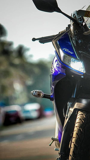 Close-up of a Blue Bajaj Pulsar R15 V3 Motorcycle Front Headlight and Fairing HD phone wallpaper