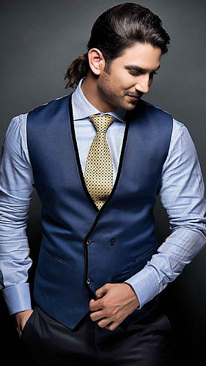 Sushant Singh Rajput in a navy waistcoat and gold patterned tie HD phone wallpaper