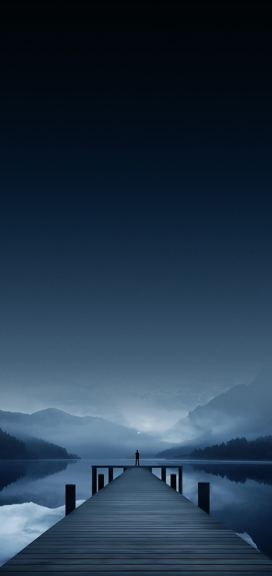 Solitary Figure on a Misty Lake Pier at Night with Distant Mountains HD phone wallpaper