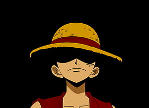 Monkey D. Luffy from One Piece in a somber close-up wearing his iconic straw hat against a dark background HD wallpaper