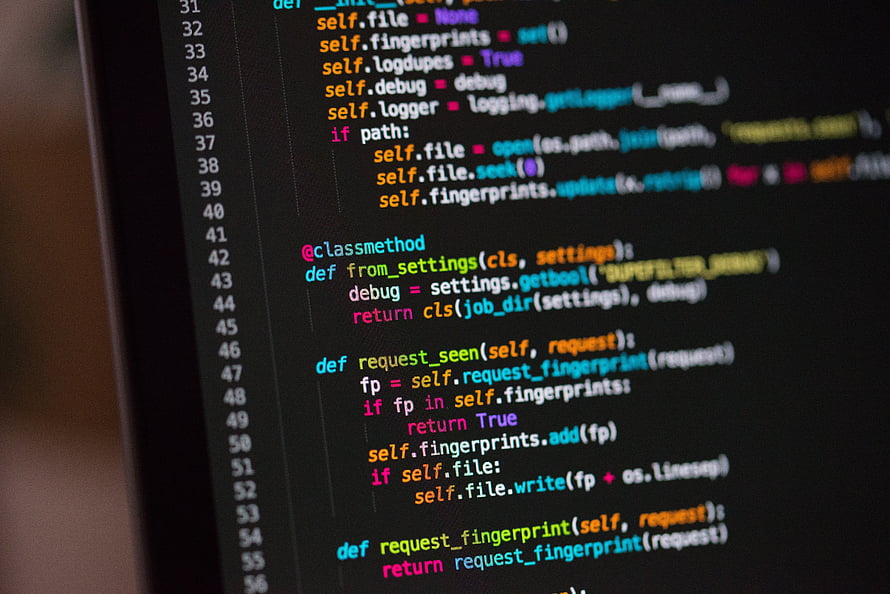 Close-up of Python source code with syntax highlighting on a dark editor background HD wallpaper