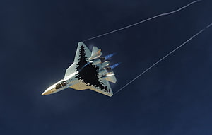 Sukhoi Su-57 Stealth Fighter Jet in Flight with Afterburners Against Dark Sky HD wallpaper