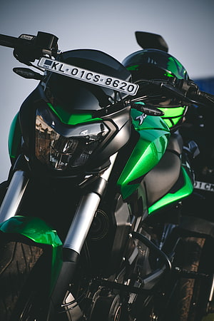 Bajaj Dominar 400 Green and Black Motorcycle Front Headlight Close-Up HD phone wallpaper