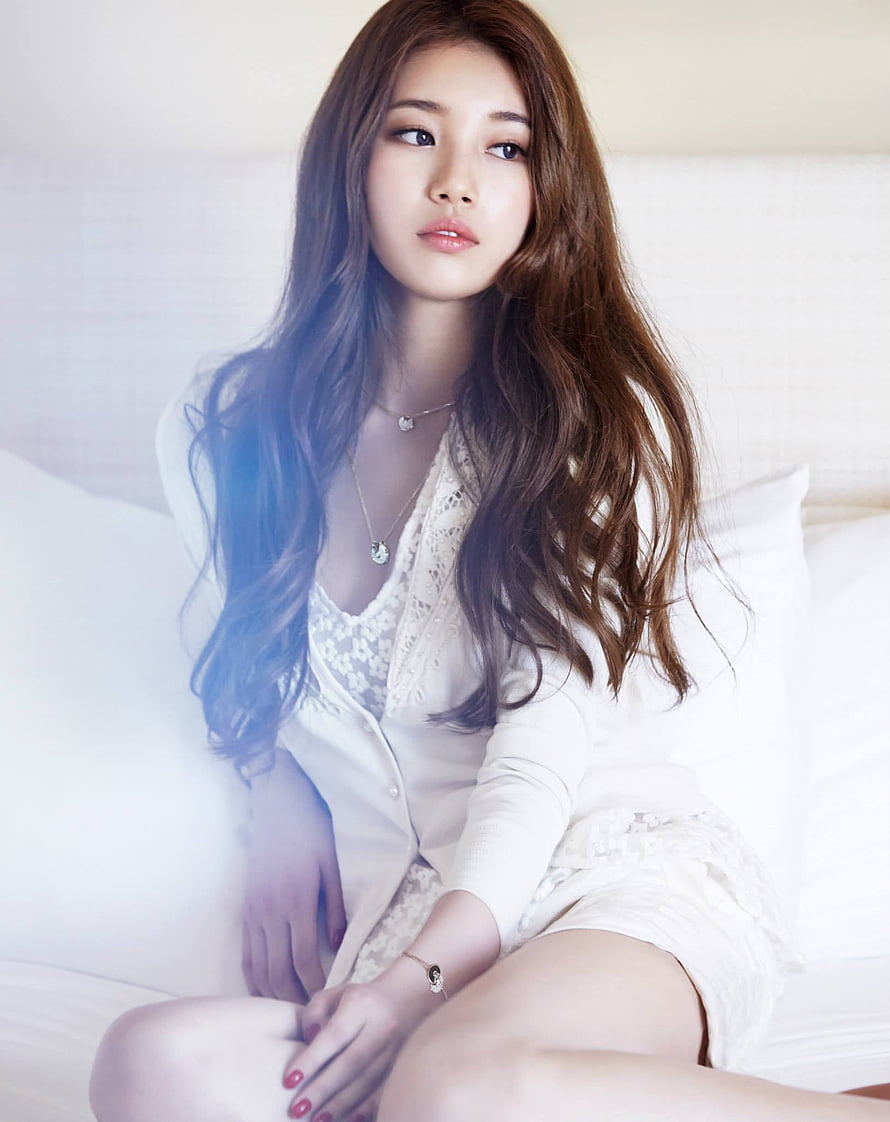 Bae Suzy in White Lace Dress and Cardigan Sitting on a Bed HD phone wallpaper