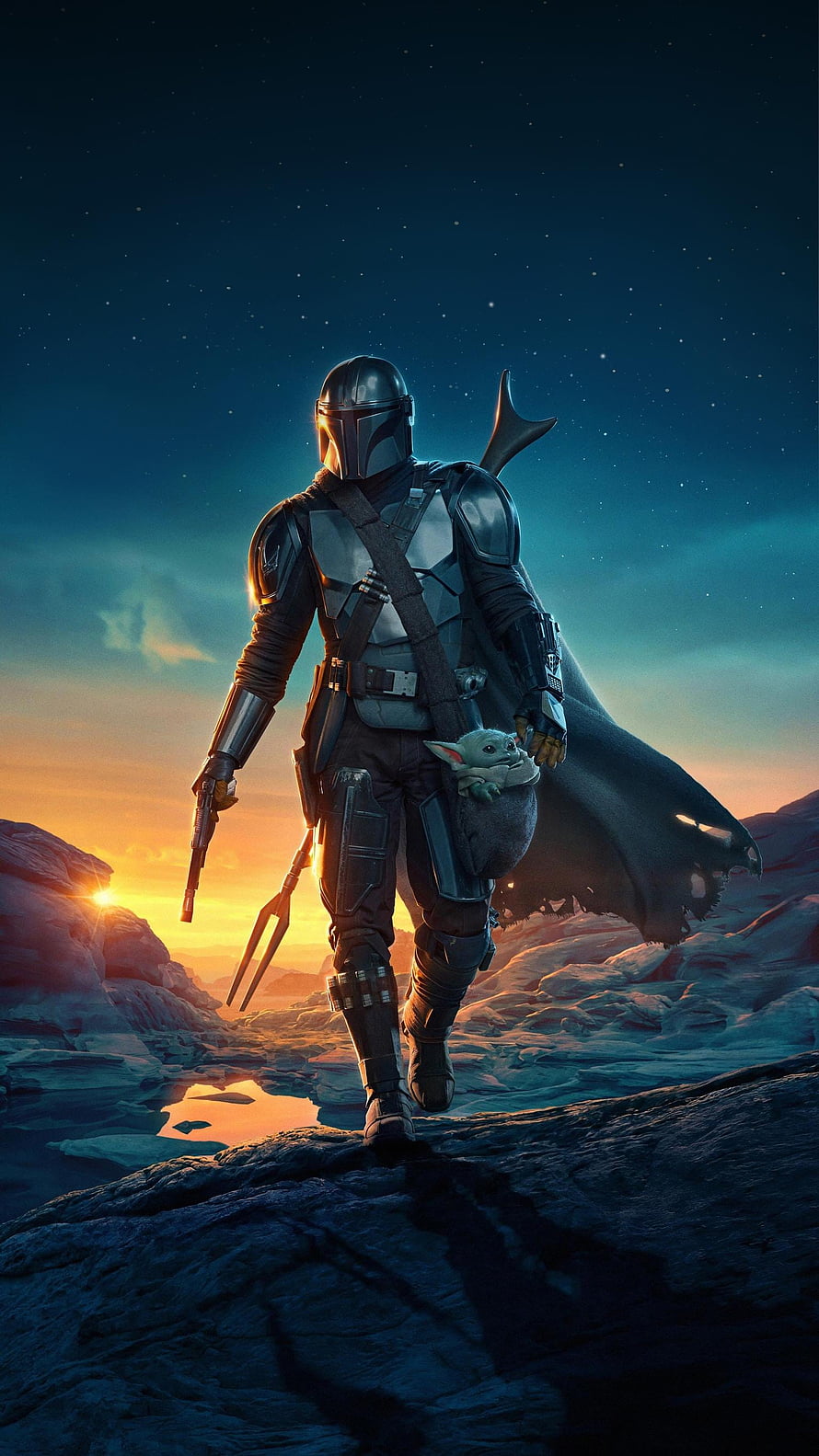 The Mandalorian and Grogu Walking Through a Rocky Desert at Sunset HD phone wallpaper