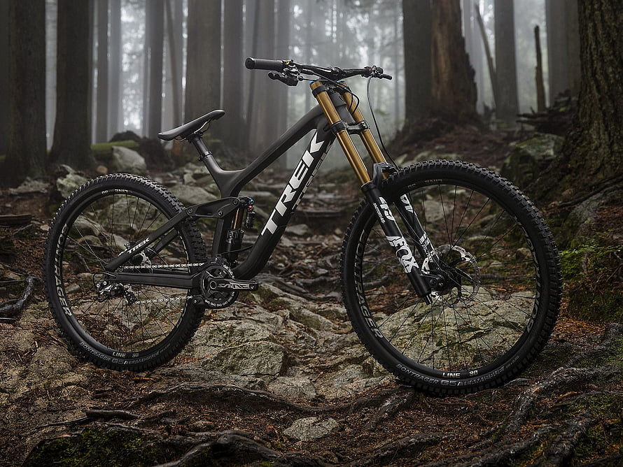 Trek Enduro Mountain Bike on Rocky Forest Trail in Misty Woods HD wallpaper