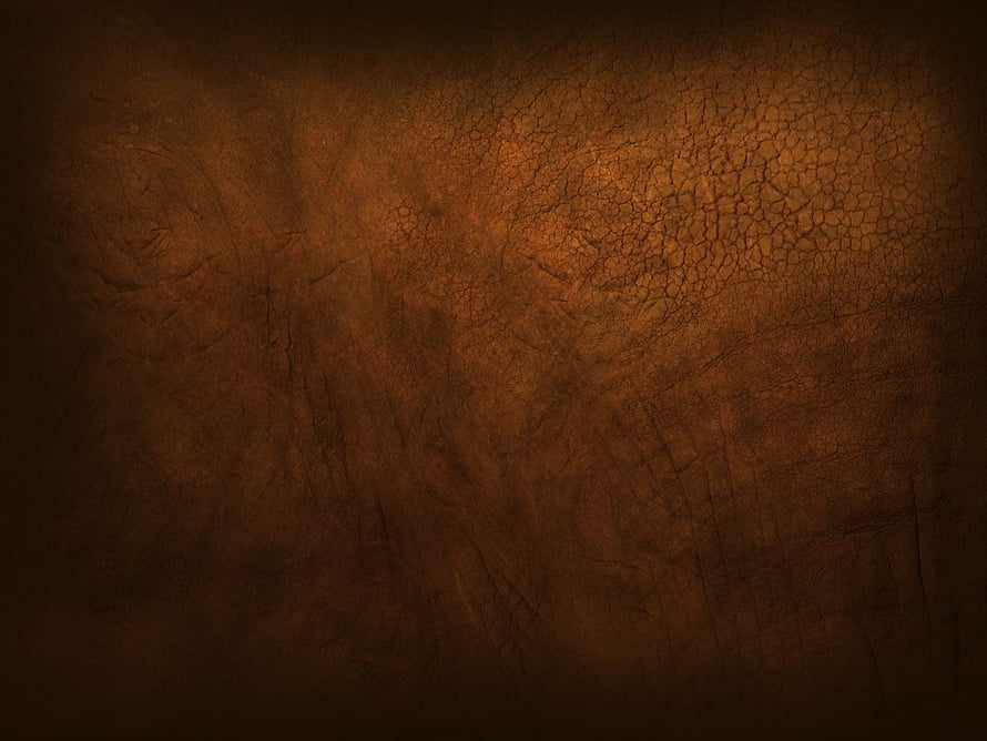 Dark Brown Cracked Leather Texture with Warm Vignette and Aged Surface Details HD wallpaper