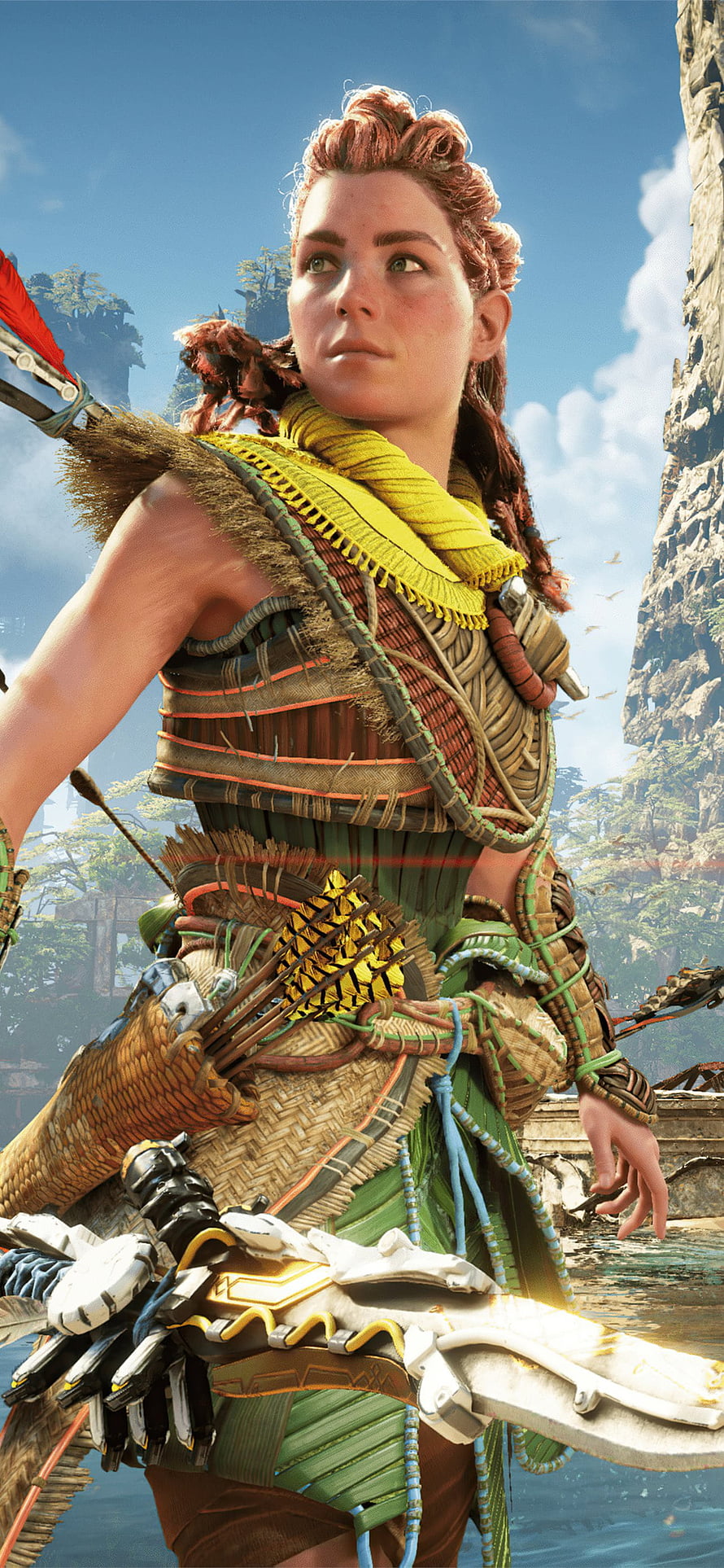 Aloy in tribal armor holding a bow in the lush landscape of Horizon Forbidden West HD phone wallpaper