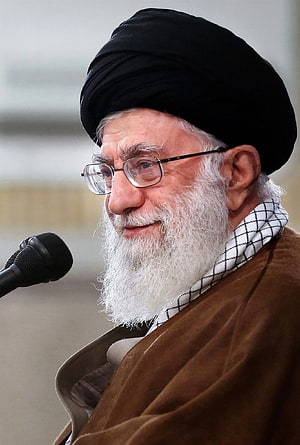 Ali Khamenei Speaking at a Public Event in Traditional Attire HD phone wallpaper