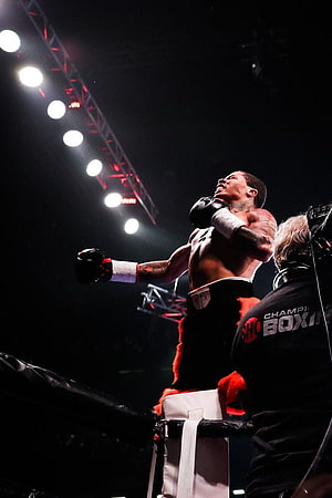 Gervonta Davis Celebrates Victory in the Boxing Ring Under Arena Spotlights HD phone wallpaper