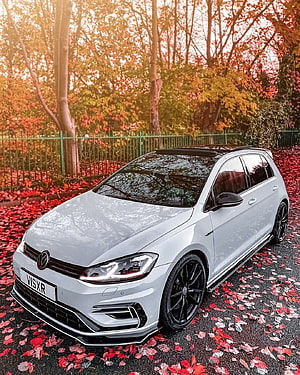 Silver Volkswagen Golf R MK7.5 parked on a path covered in red autumn leaves HD phone wallpaper