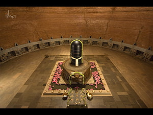 Dhyanalinga Sacred Shrine at Isha Yoga Center with Flower Offerings and Brass Lamps HD wallpaper
