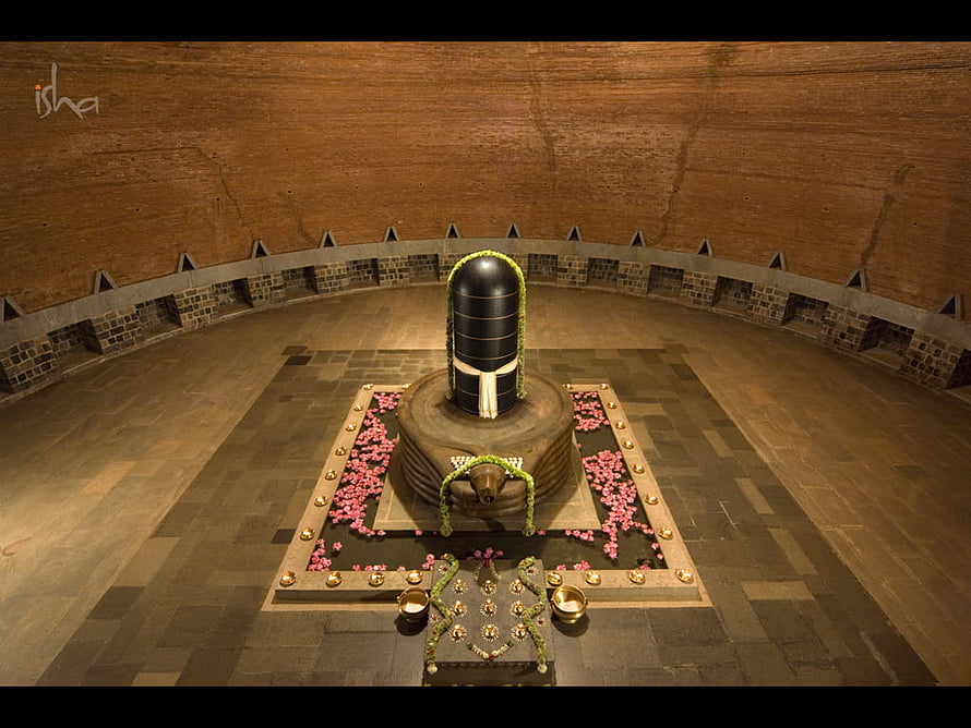 Dhyanalinga Sacred Shrine at Isha Yoga Center with Flower Offerings and Brass Lamps HD wallpaper