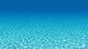 Calm Turquoise Ocean Surface With Gentle Ripples And Sunlight Patterns HD wallpaper