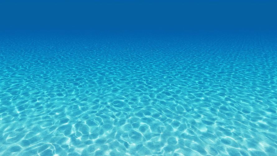 Calm Turquoise Ocean Surface With Gentle Ripples And Sunlight Patterns HD wallpaper